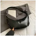 Minimalist black shiny faux leather crescent hobo bag with sleek shoulder strap - No Pendant / Black