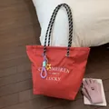 Red checkered canvas tote bag with woven handles and star charm accessory - With Pendant / Red