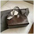 Minimalist large capacity tote bag in dark brown faux leather with textured finish - Brown