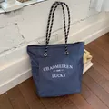 Navy blue checkered canvas tote bag with rope handles and white graphic lettering - No Pendant / Blue