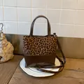 Fashionable leopard print and brown leather bucket bag with top handle and strap - Leopard Print No Charm