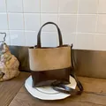 Apricot suede and coffee leather bucket bag with dual handles and crossbody strap - Khaki No Pendant