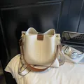 White woven bucket bag with brown leather trim and wide canvas shoulder strap - Beige Checkerboard