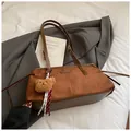 Caramel brown suede and leather tote bag featuring a cute plush bear charm and woven tassel - With Pendant / Brown