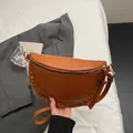 Brown half-moon saddle bag with gold stud rivets and adjustable leather shoulder strap - Brown