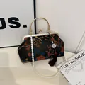 Retro Chinese style embroidered peony satin bag with gold handle and pearl chain - Brown