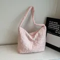 Pink quilted heart-pattern hobo tote bag with a soft texture and zipper closure - Pink