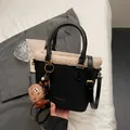Black faux suede tote with cream faux shearling trim and cute plush charms - Black With Pendant