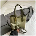 Deep green woven bucket bag with stylish puppy pendant and detachable shoulder strap - Woven Design / Green (With Puppy Charm)