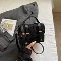 Minimalist black velvet box handbag with gold hardware and stylish leather details - Black