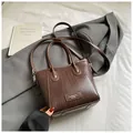 Deep brown PU leather woven textured handbag with adjustable crossbody strap - Woven Design / Coffee (No Pendant)