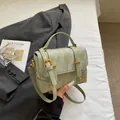 Structured mint green marble pattern handbag with gold hardware and top handle - Green