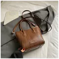 Brown woven straw tote bag with top handles and a long shoulder strap for women - Woven Design / Brown (Without Pendant)