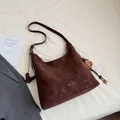 Dark brown suede hobo tote bag with London branding and flower charm accessory - With Charm / Coffee