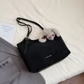 Minimalist black tote bag with matte texture and a grey plush bunny charm detail - With Pendant / Black
