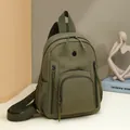 Olive green waterproof nylon backpack with multiple zipper pockets and wide straps - Green