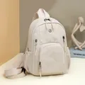 Minimalist beige nylon backpack with large capacity and multi-pocket functional design - White