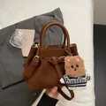 Dark brown pleated suede handbag with detachable strap and cute bear charm detail - With Bear Pendant / Brown