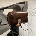 Vintage dark brown crossbody bag in oil wax faux leather with silver buckle detail - Brown