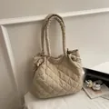 Quilted beige puffer tote bag with large diamond stitching and soft padded handles - Beige