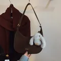 Dark brown suede hobo shoulder bag with a cute plush rabbit pendant and gold buckle - With Pendant / Brown