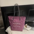 Purple checkered canvas tote bag with woven handles and white embroidered typography - Lilac Large