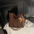 Dark brown suede tote bag with golden chain strap and decorative bear keychain - With Charm / Brown