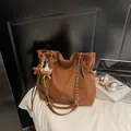 Brown suede tote bag with chain strap and cute plush charms for daily commute - With Charm / Brown