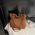 Brown suede tote bag with drawstring closure and golden chain straps in a casual set - No Pendant / Brown