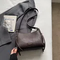 French vintage dark brown shoulder bag with lychee texture and metallic logo detail - Coffee without Pendant