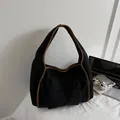 Corduroy shoulder bag in black and brown contrast, styled with tech accessories - Black