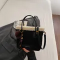 Black suede bucket bag with white faux fur trim and fashion lettering with pompom - Black With Pendant