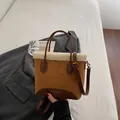 Brown suede bucket bag with white faux fur trim and adjustable leather shoulder strap - Brown No Pendant