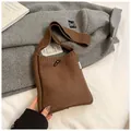 Brown knitted crossbody bag with toggle closure and vertical cable stitch texture - Brown