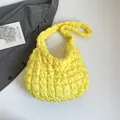 Quilted cloud shoulder bag in vibrant yellow with soft puffy texture and padded handles - Yellow