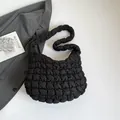 Fashionable black quilted cloud shoulder bag with puffy texture and minimalist design - Black