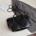 Minimalist black tote bag in litchi grain faux leather with adjustable side buckles - Without Pendant / Black