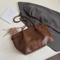 Chic dark brown faux leather tote bag with vertical stitching and plush bear charm - With Pendant / Brown