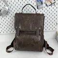 Dark brown retro PU leather backpack with vintage texture and adjustable metal buckles - Brown No Pendant