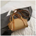 Retro-Umhängetasche aus Canvas und braunem Leder mit Griffen im minimalistischen Stil - Khaki