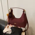 Burgundy moon-shaped hobo bag with ethnic tassel charm and adjustable shoulder strap - Wine Red with Pendant