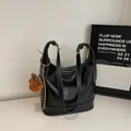 Black leather hobo shoulder bag with contrast stitching and leopard bear charm - With Ornament / Black