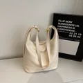 Minimalist cream white soft leather bucket bag with wide straps and gold hardware - Without Ornament / Off White