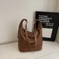 Retro dark brown leather shoulder bag with white contrast stitching and adjustable strap - Without Ornament / Brown