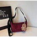 Burgundy suede half-moon crossbody bag with letter print and plush bear charm - Wine Red With Pendant
