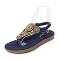 Detail of bohemian flat sandals featuring deep blue T-straps with rhinestones and gems - EU 38 / Blue