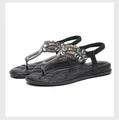 Detail view of black rhinestone flat sandals with elastic back strap and quilted footbed - EU 35 / Black