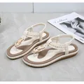 Detail of cream T-strap toe-loop sandal with gold buckle and braided texture strap - EU 36 / Apricot