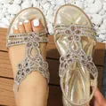 Women's gold bohemian flat sandals with sparkling rhinestone floral hollow patterns - Gold