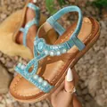 Detail of light blue Bohemian flat sandals featuring rhinestones and elastic heel strap - EU 38 / Light Blue